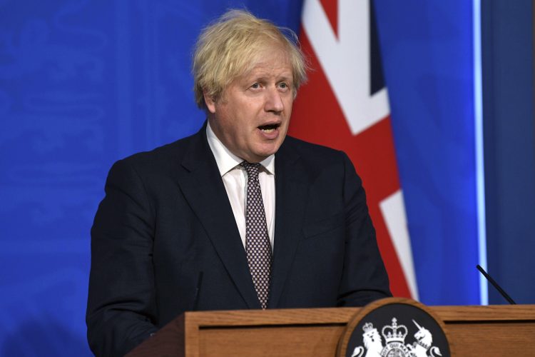 Johnson says restrictions to ease, UK must live with virus